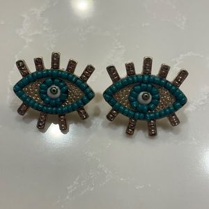 Green and gold eye earrings
